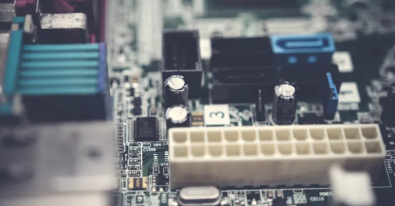 Detailed view of electronic components on a circuit board, showcasing modern technology.