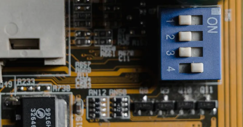 Detailed view of a circuit board showing switches and microchips.